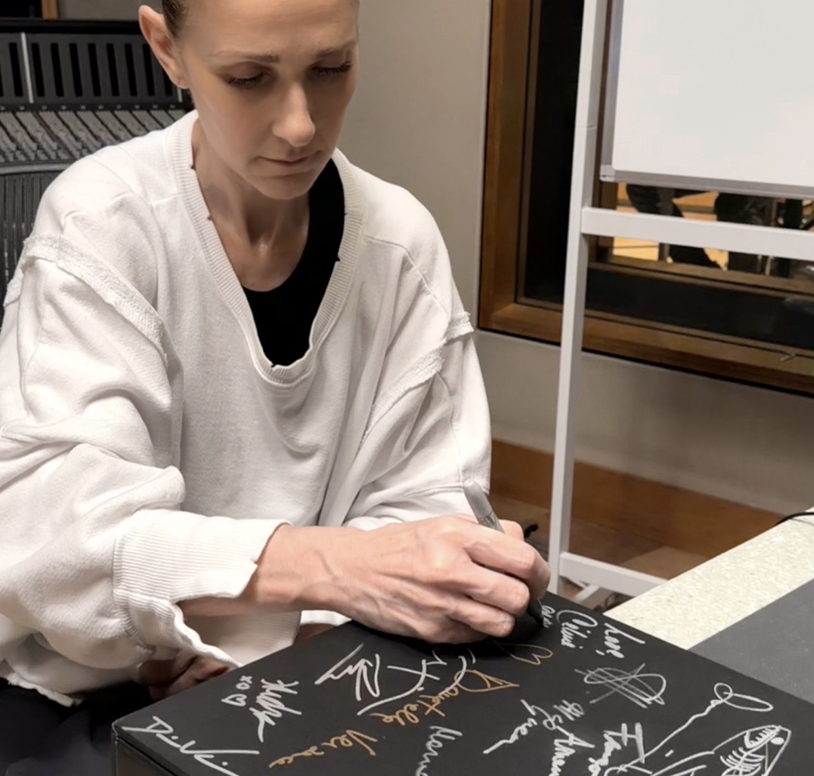 Celine Dion signing the Misfits Pride Edition