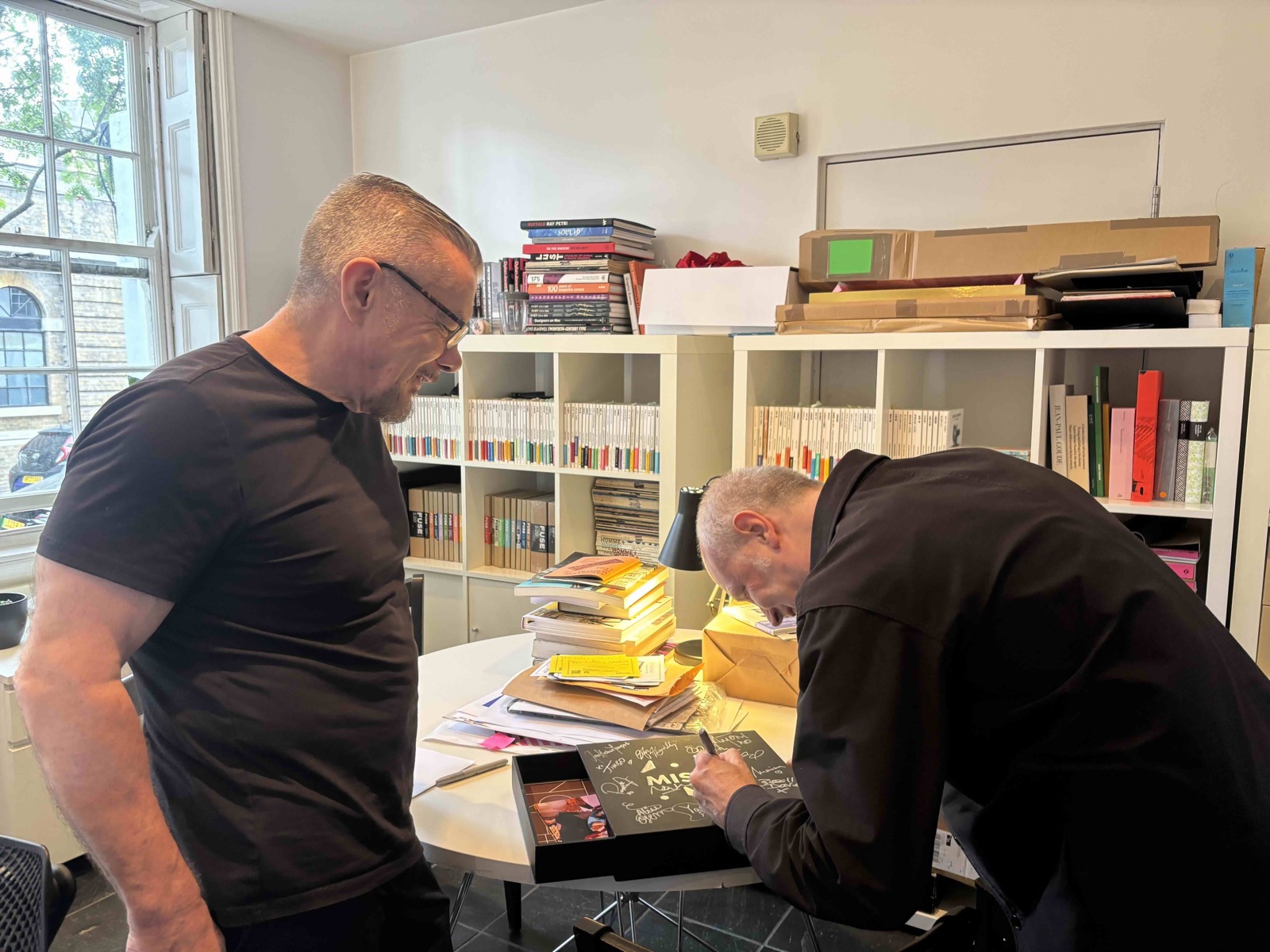 Jonathan Barnbrook and Neville Brody signing the Misfits Pride Edition